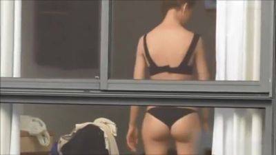 Spying on neighbour undressing. - voyeurhit.com